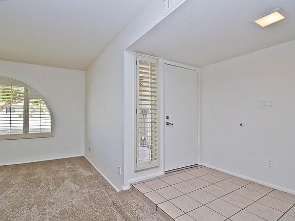 Front Entry Steps Down into Livingroom