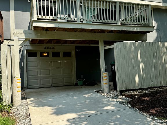 Back of Property. Concrete Driveway, One car garage, Back Deck