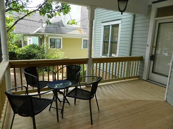 Covered front porch with plenty of space to lounge