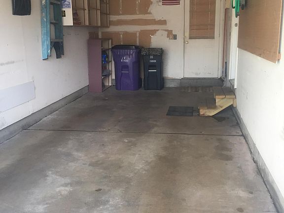 Single car, extra long garage with door leading to backyard