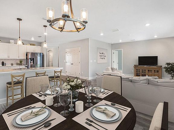 You will love the large gathering room, open to the kitchen and cafe - New home for sale in Lakeland