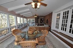 Sunken Sunroom - Walls of windows overlooking lake, woodburning stove, sliders