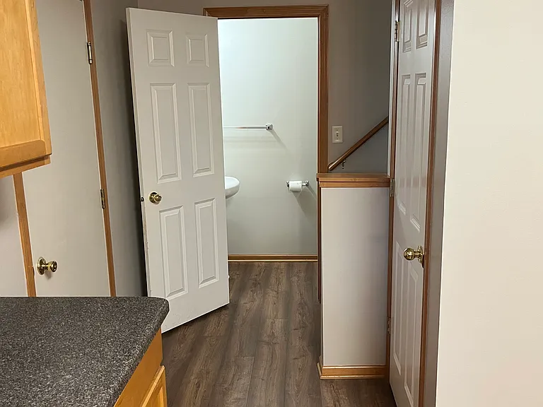 Entry from garage on left, coat closet on right, bathroom straight ahead.