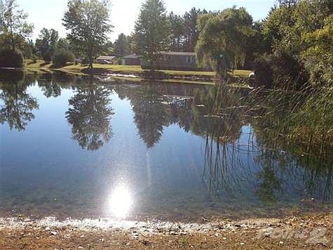 Very nice! View of house from other side of pond