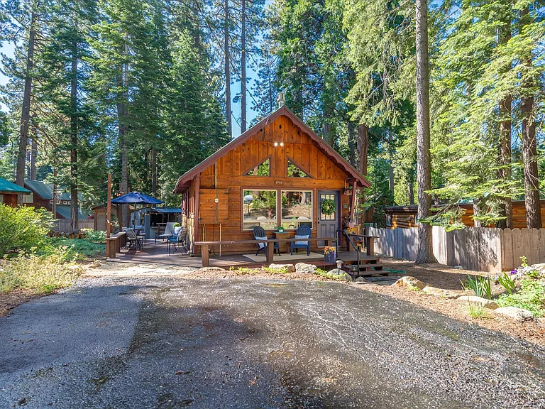 Front view of cabin with level access parking for 2 vehicles.