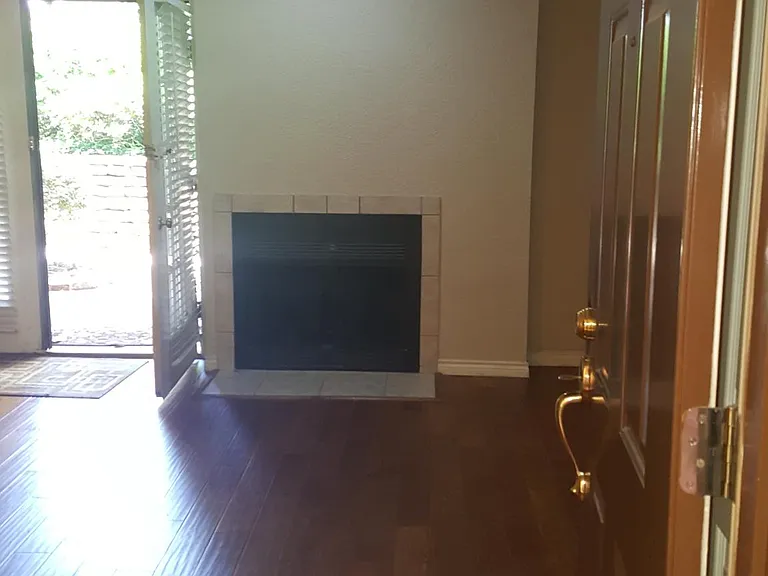 Living room from entrance and with back patio door open