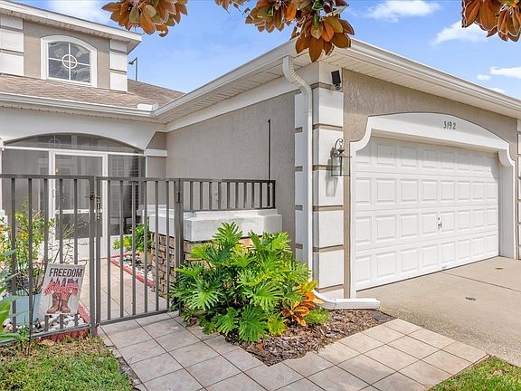 The front of the house, which includes a two-car garage

*This listing showcases furniture currently in the unit, however, the space will be completely empty at the time of rental.*