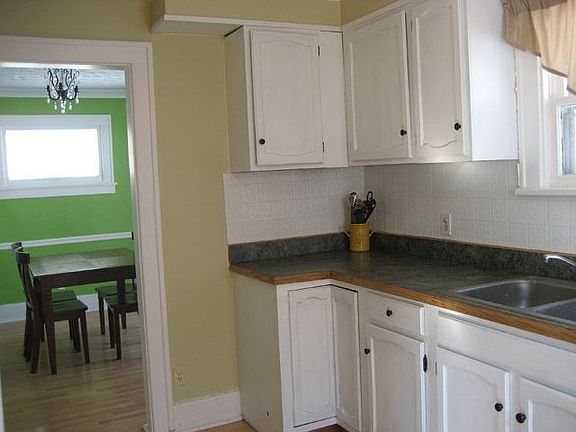 Partial view of updated kitchen opening to dining room