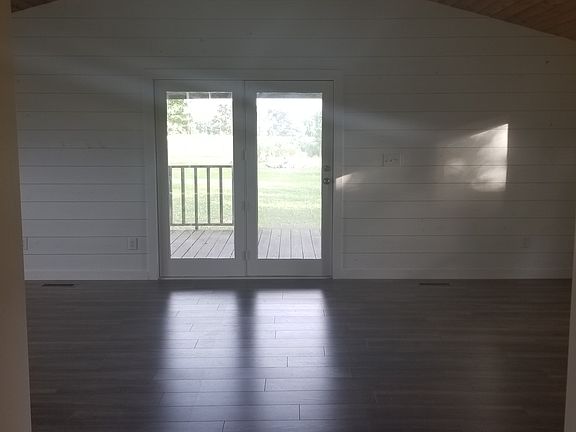 Vaulted ceiling in sunroom. 