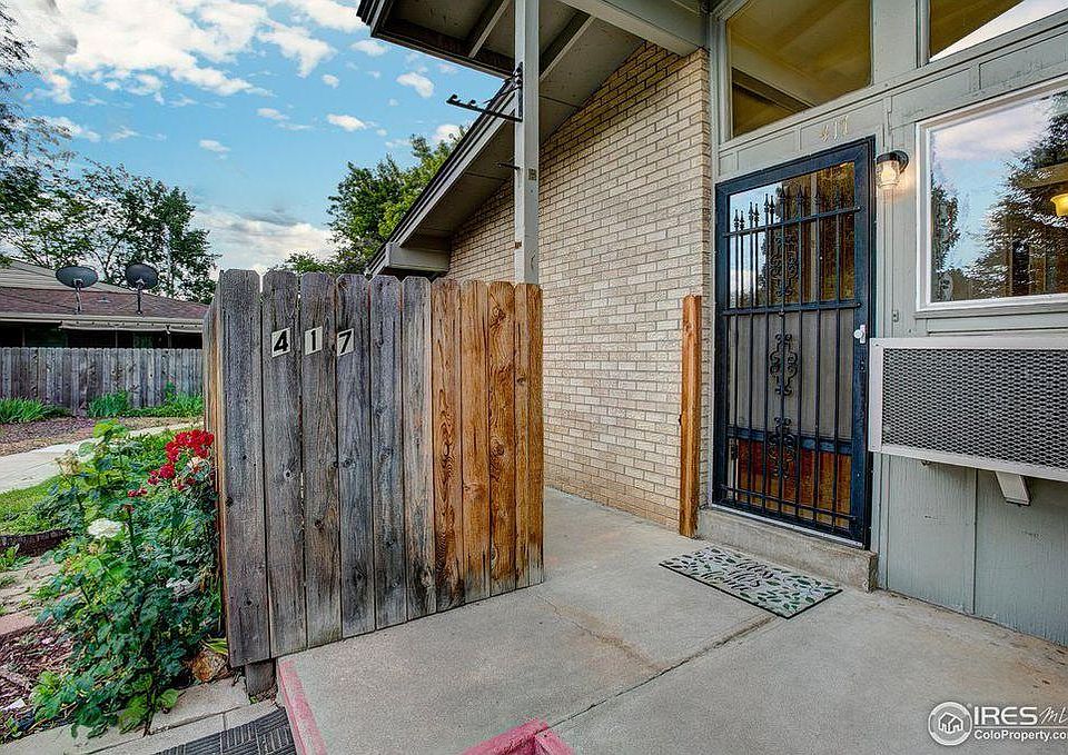 private patio and front entrance with A/C unit.