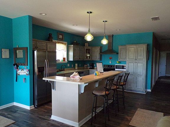 Large kitchen with seating for 3 on the island.