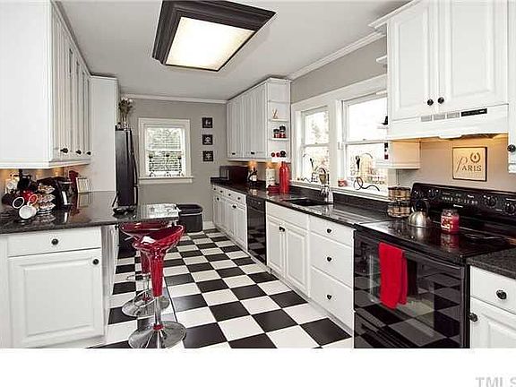 A SoHo kitchen opens to the Craftsman style deck.