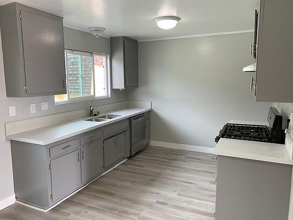 Kitchen. New stove, counter tops, dishwasher and windows