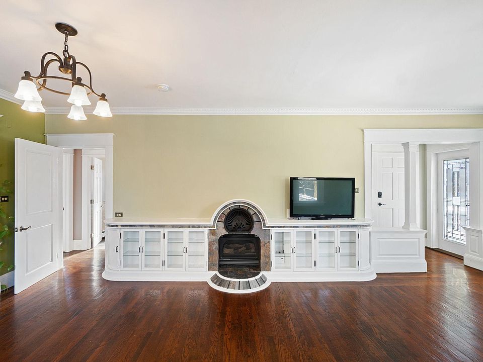 Fireplace and built-in storage in the living room.