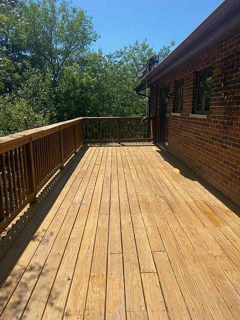 Deck with roll-out canopy