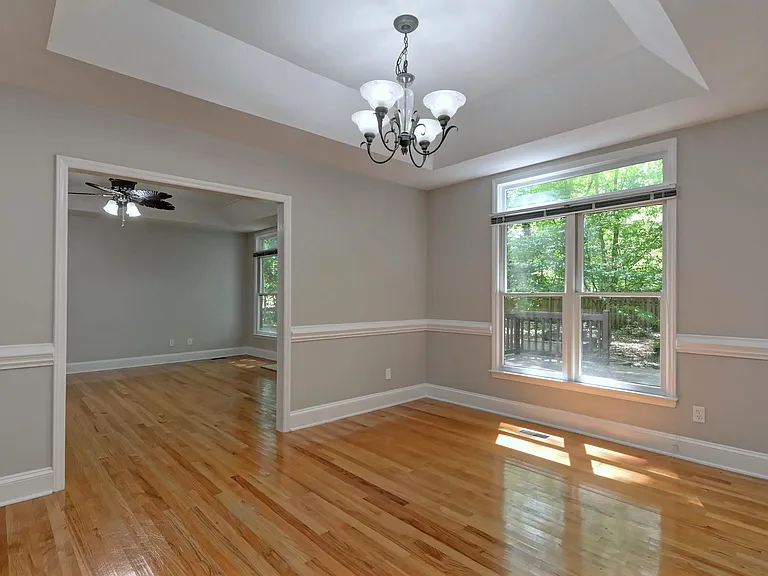 dining room next to kitchen on one side and great room on the other