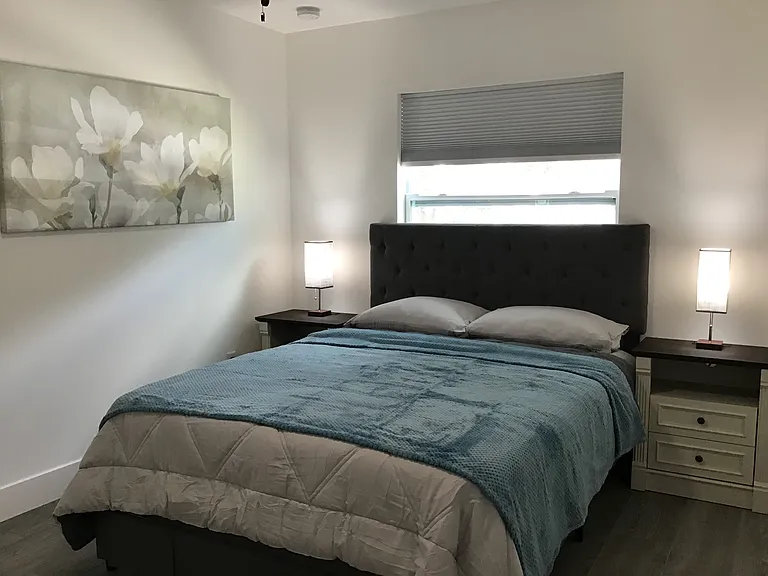 Peaceful secondary bedroom designed for restful extended stays with full furnishings.