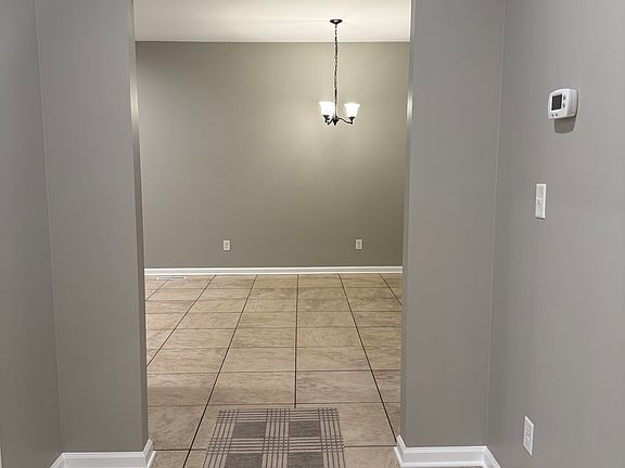 Looking from front door. Standing in living room and looking into the kitchen eating area. Two front bedrooms are off to the right and the coat closet is to the right.