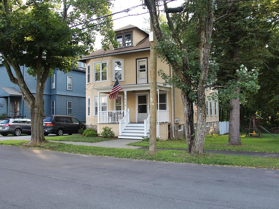 View of front porch and tree-lined street