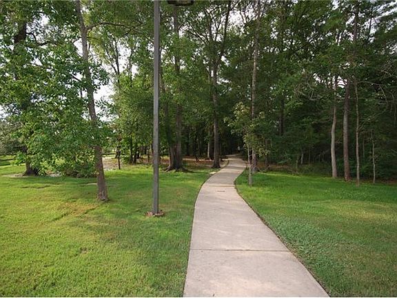 Meandering trails into serene wooded areas is an invitation to pensive moments of solitude.