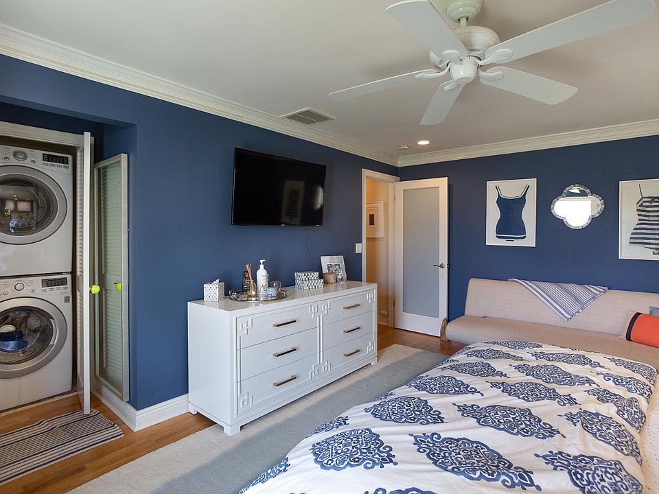 Primary bedroom with walk in closet and full size laundry.