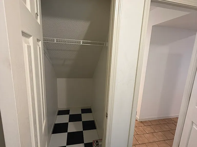 Under-stairs storage with new floor