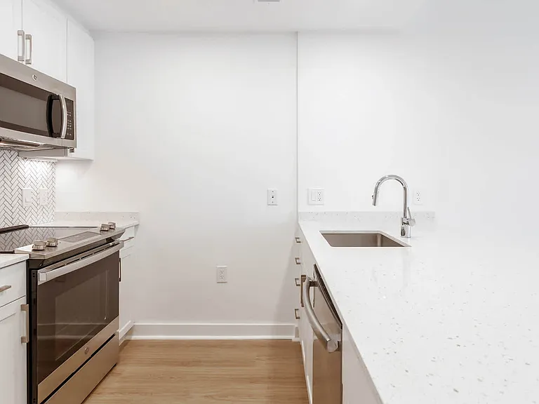 Kitchen with Quartz Countertops and Stainless Steel Appliances