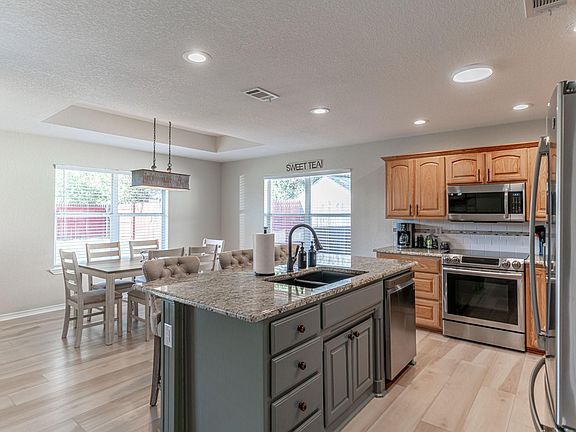 Kitchen has room to move, many cabinets and also a pantry