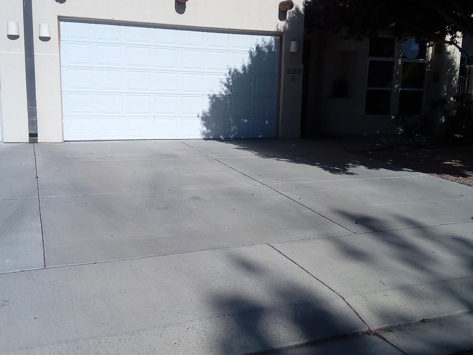 2-car garage driveway and front door entry (right)