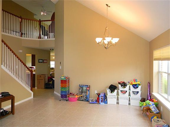 Stairway overlooking formal dining or formal living area.