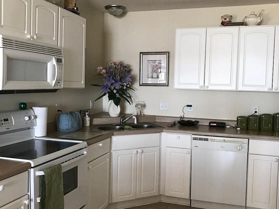 Fresh open kitchen with microwave, dishwasher, range, and refrigerator