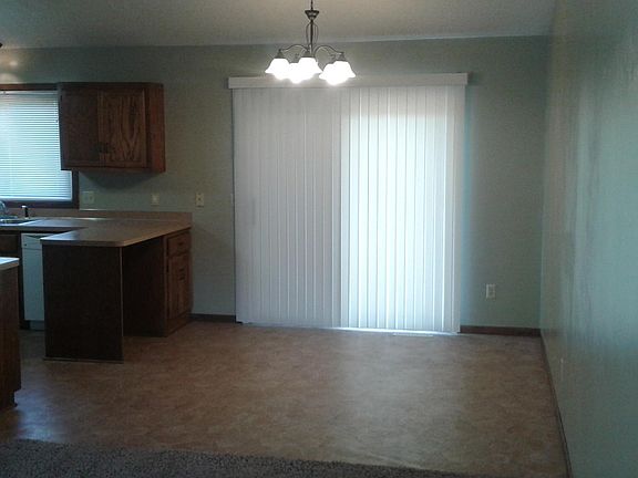 DINING AREA WITH A SLIDING GLASS DOOR TO THE REAR YARD DECK