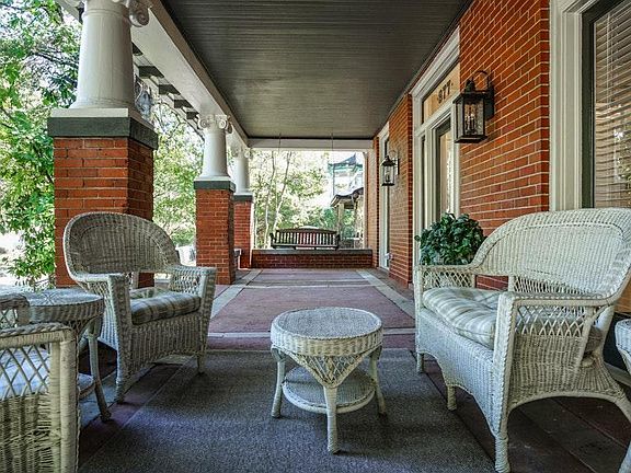 Deep front porch with private french doors leading to porch