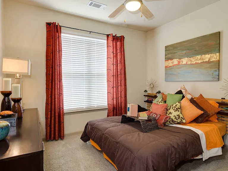 Spacious bedrooms with high ceilings and large windows for natural lighting