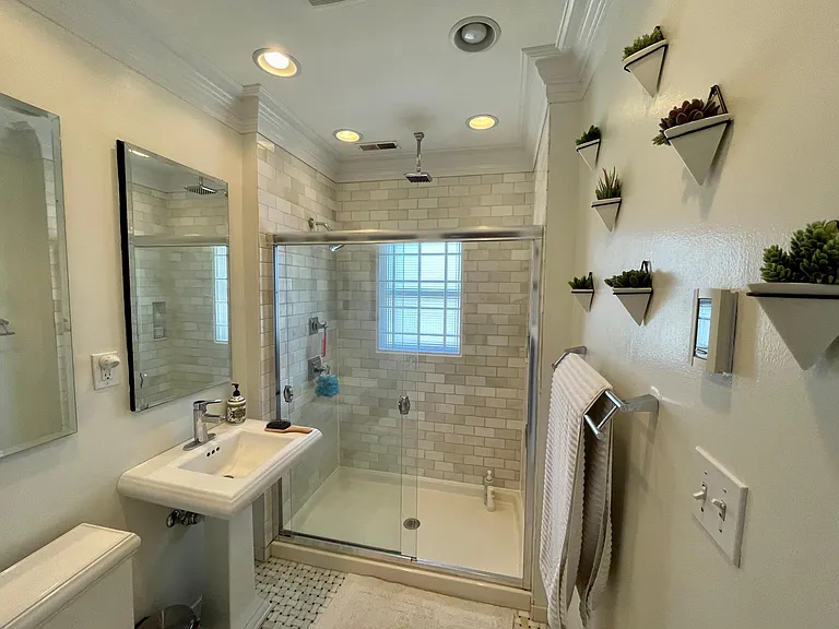 Heated tile floors - medicine cabinets behind both mirrors