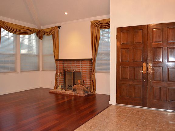 Living Room with High Ceiling & Hardwood Floor