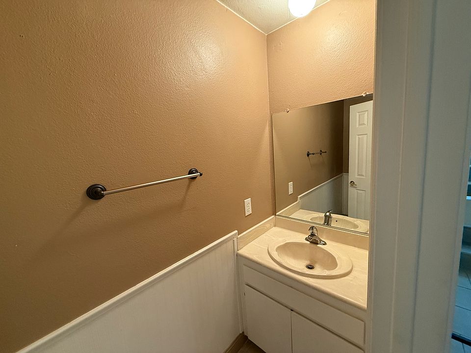 Downstairs bathroom with sink and toilet