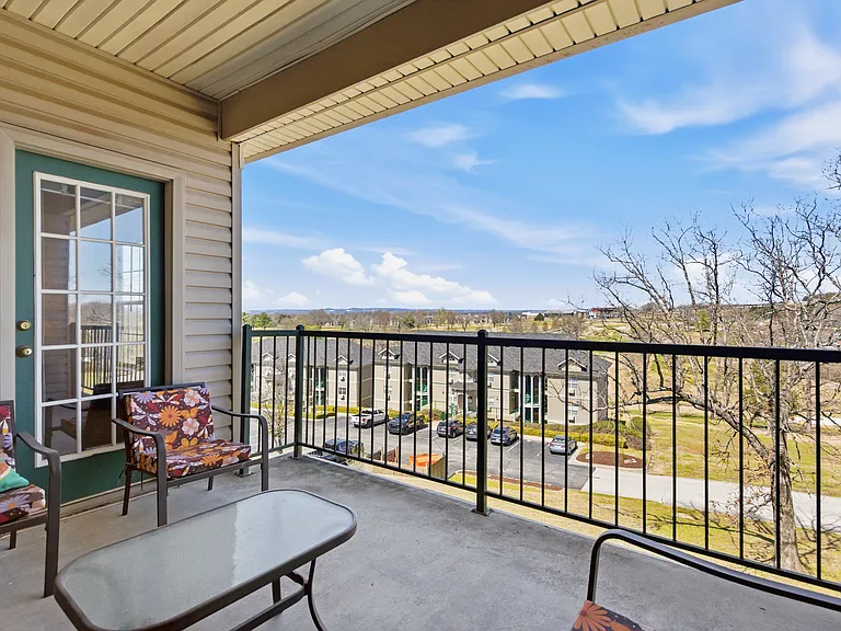 Back covered patio overlooking golf course.