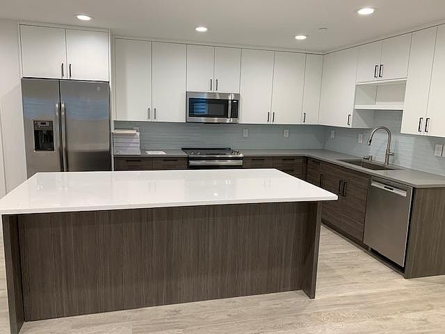 Soft touch cabinets, stainless steal appliances, 6x3 island with extra cabinets and stool area for 3.