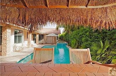 Far background beyond spa you can see strip of artifical gra