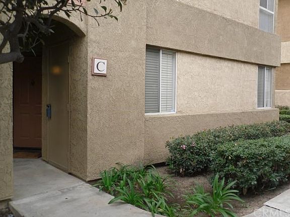 Welcome home! Private storage closet by front door, windows of living room which leads from front door..