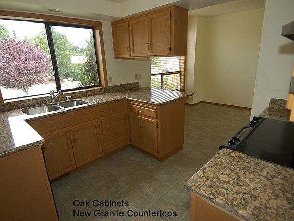 Oak Cabs. w/Granite