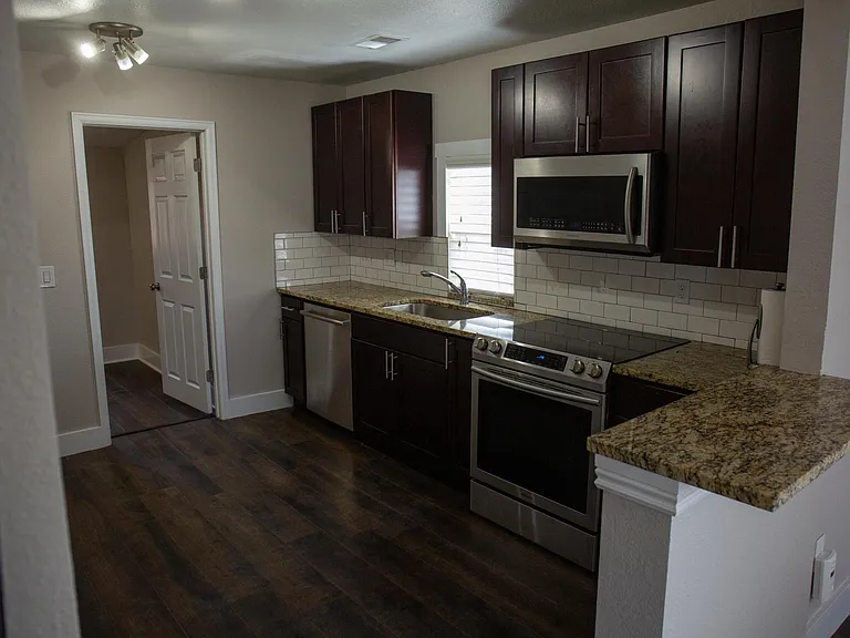 Kitchen with door leading into master bedroom
