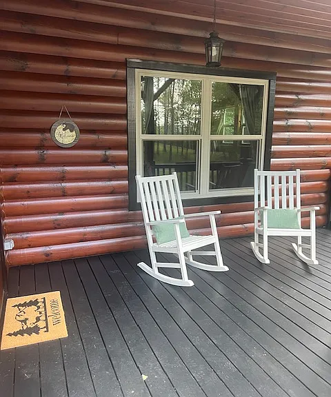 front deck by entrance door with rocking chairs