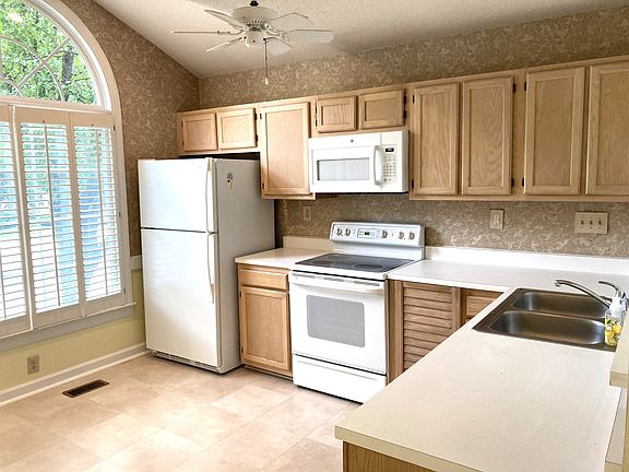 Modern kitchen has all appliances and plenty of storage - pantry too