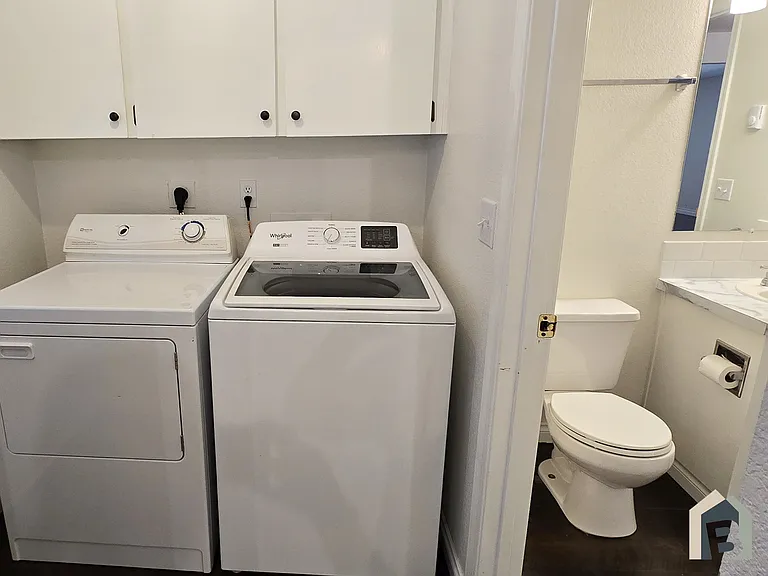 Laundry room on 1st floor with storage, & bathroom