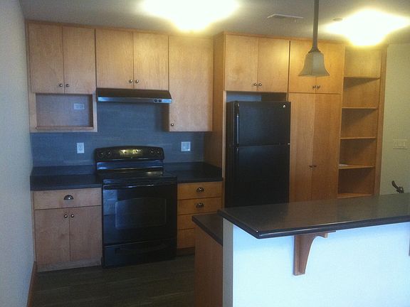 Kitchen showing Appliances in Unit