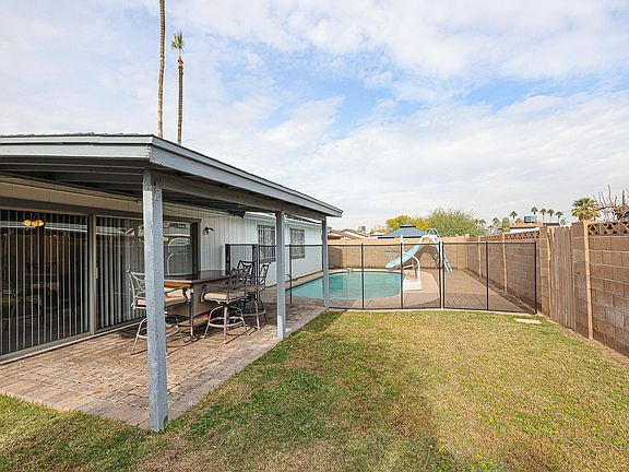 The pool fence was added in 2022. Pool has a solar heater.