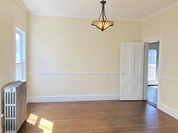 Dining room with natural light connected to kitchen.