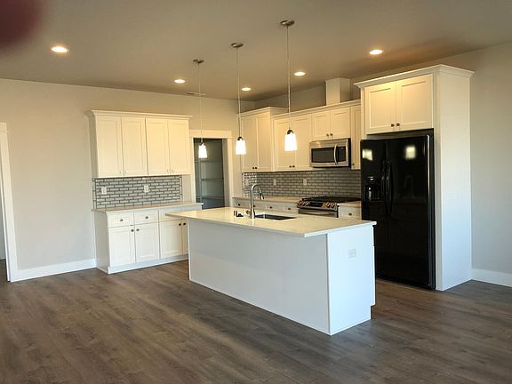 Kitchen with Walk-In Pantry, Gas Range, Dish Washer, Microwave and Refrigerator